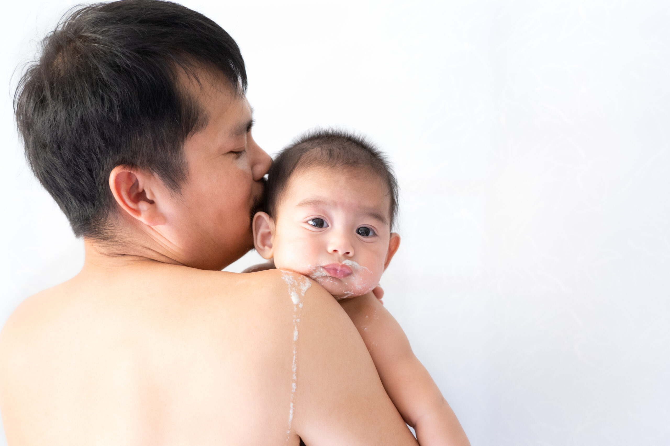 close up of asian father is carring his baby to be 2022 11 04 02 45 29 utc 1 scaled