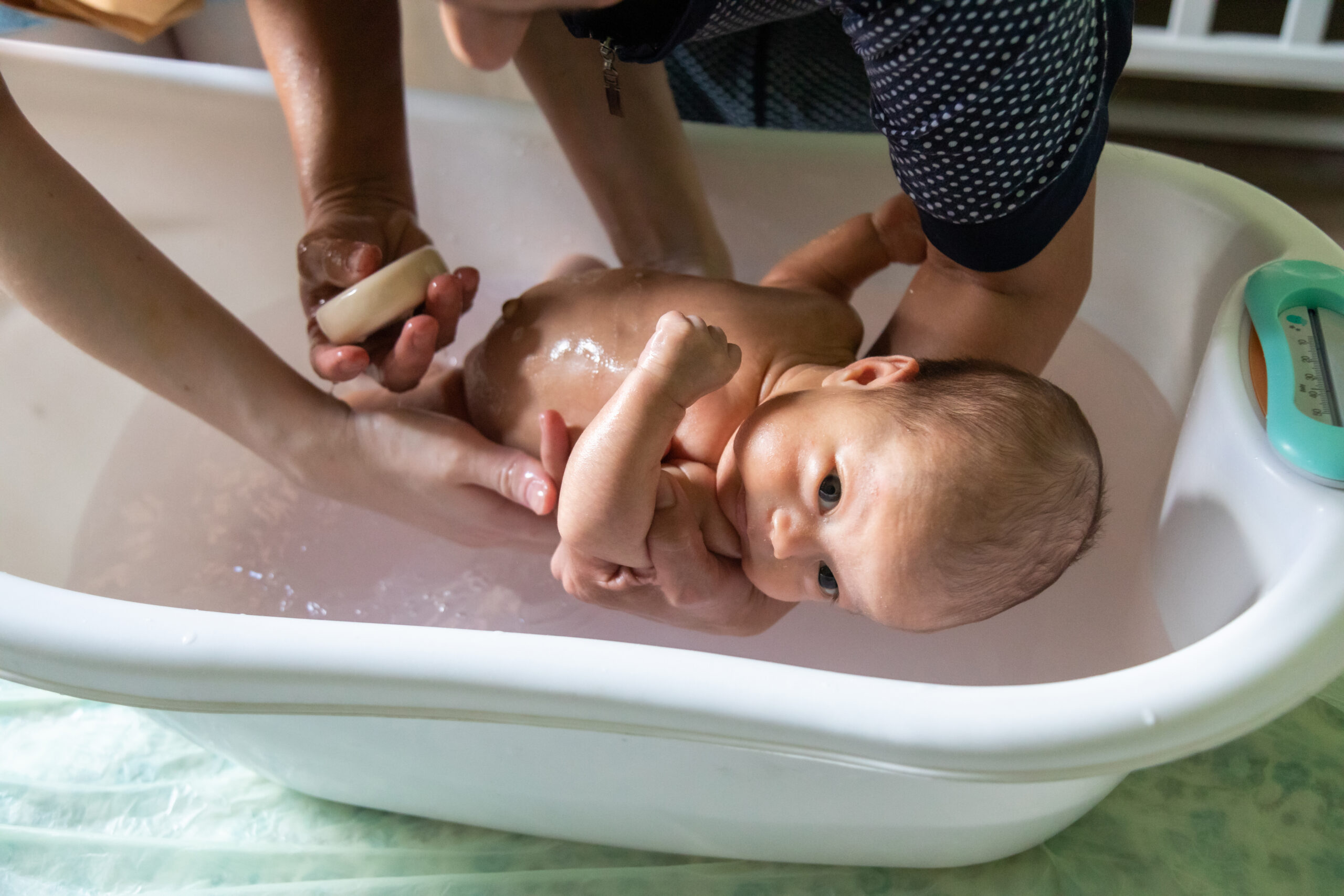 closeup of newborn baby bathing in a baby bath 2022 06 09 15 13 21 utc scaled