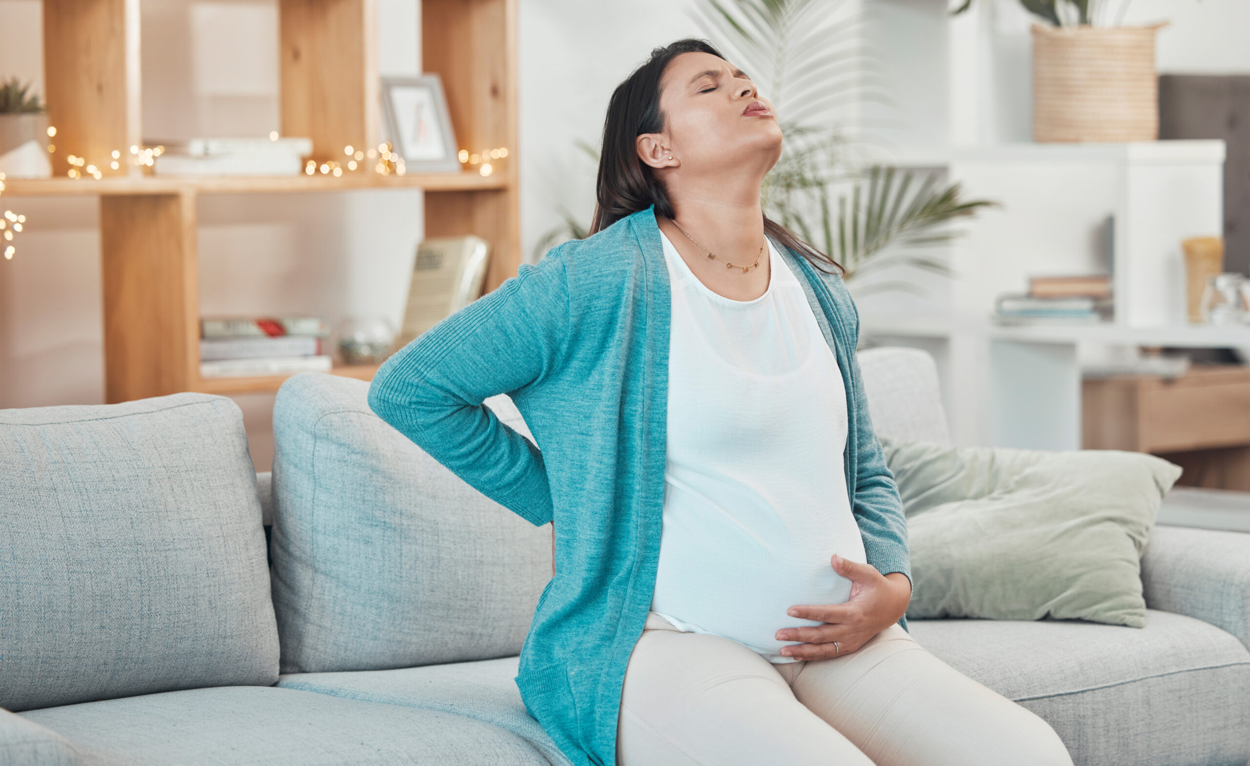 pregnant woman breathing and stomach pain on sofa 2022 12 23 01 00 17 utc scaled