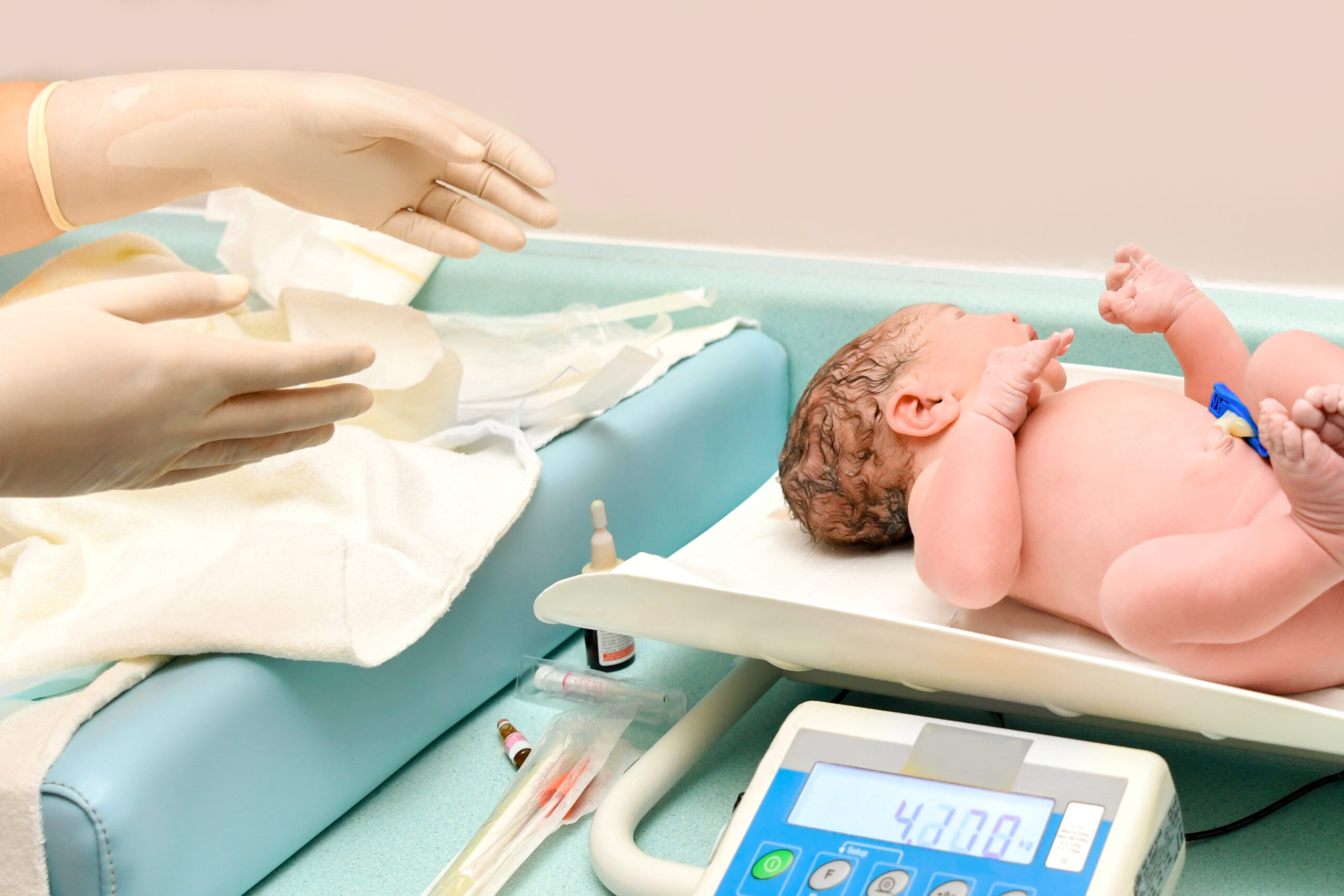 a nurse weighs on the scales of a newborn baby 2022 09 23 23 16 40 utc scaled
