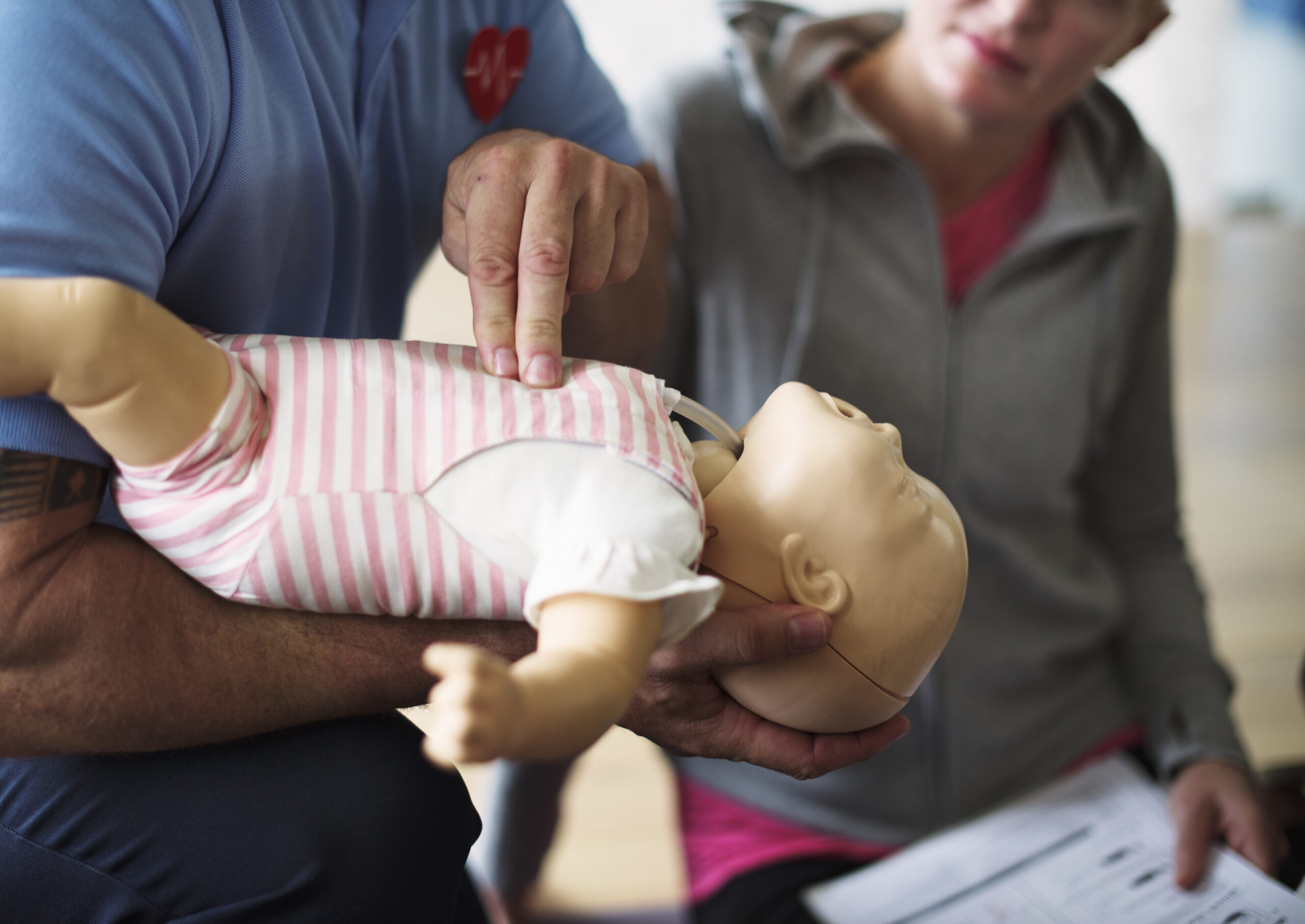 cpr first aid training on a doll infant 2022 12 16 00 51 24 utc scaled